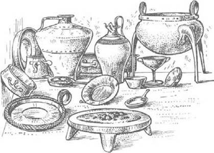 Figure 27 Bronze objects from a tomb at Zafer Papoura, Knossos. The tripod in the foreground is a portable hearth or offering table made of plaster