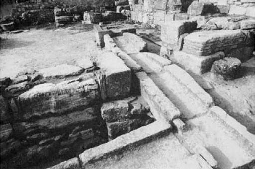 Plate 9 A stone drain at Knossos