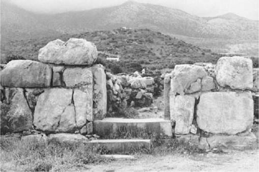 Plate 10 Mallia. The temple ruins in the foreground, peak sanctuary in the middle distance, and the mountains of Lasithi on the skyline