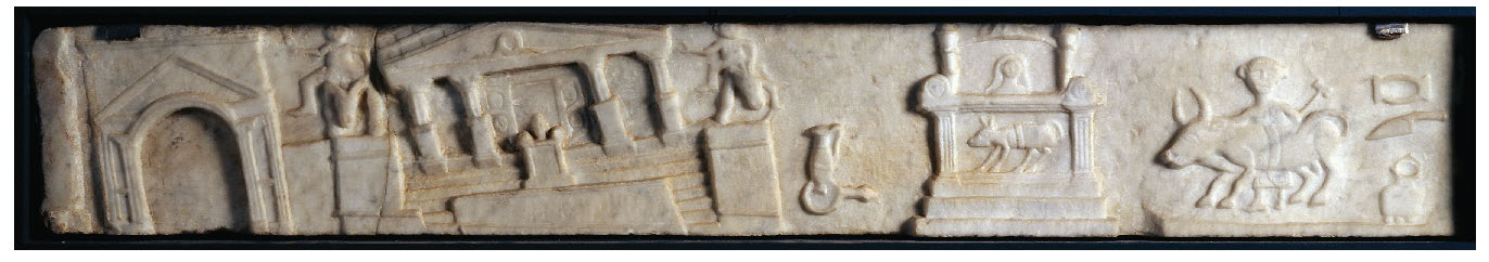 A marble relief shows buildings at Pompeii (the north end of the Forum or north of the Forum, tilted at angles due to AD 62/63 earthquake damage: an arch and temple at the left, an altar at the right, with a bull and an attendant ready to sacrifice the bull standing behind it, with sacrificial implements shown at the far right edge of the relief.