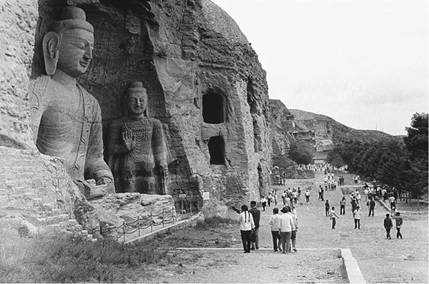 This large Buddha from the Northern Wei dynasty (460-493 ce), in Cave number 20 at Yungang, near modern Datong (Shanxi Province), is now exposed to the elements because of the collapse of the cave.