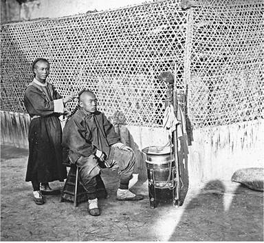 An itinerant barber in Beijing, photographed in 1865