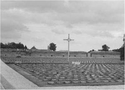 The competition of victims. Cross as monument to the victims of the Little Fortress in Terezin (Theresienstadt), Czech Republic. Note the smaller Star of David in the background (left). Jews were the majority of victims in this camp.