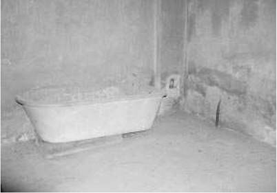Mirrors of inhumanity. Bathtub of the commander of the Majdanek crematorium, facing the ovens. Mirrors of inhumanity. Bathtub of the commander of the Majdanek crematorium, facing the ovens.