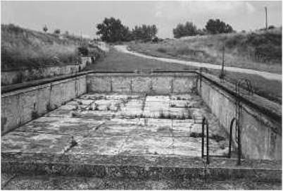 Mirrors of inhumanity. The swimming pool of the German guards in the Little Fortress in Terezin (Theresienstadt), Czech Republic, located next to the path leading to the execution wall. Mirrors of inhumanity. The swimming pool of the German guards in the Little Fortress in Terezin (Theresienstadt), Czech Republic, located next to the path leading to the execution wall.