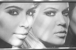 A screen with the faces of Kim and Khloe Kardashians both turning to face forward is seen. Only their faces are seen.