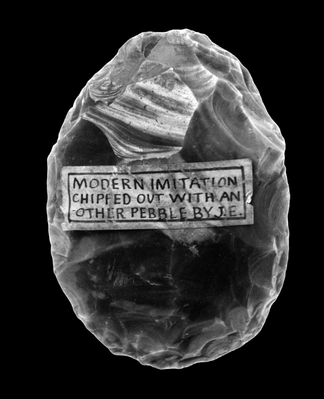Photograph of a replica biface, oval in outline.