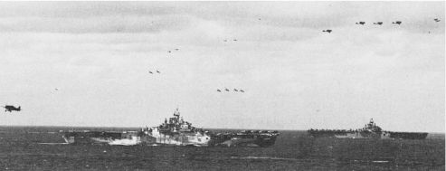 Hellcats break into four-plane divisions prior to landing aboard two Essex-class carriers before the first strikes against Tokyo in February 1945.