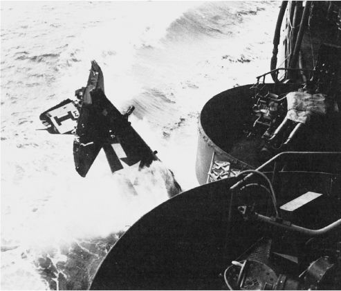 This shot-up Hellcat was jettisoned from the escort carrier Block Island in May 1945, being too heavily damaged to repair.